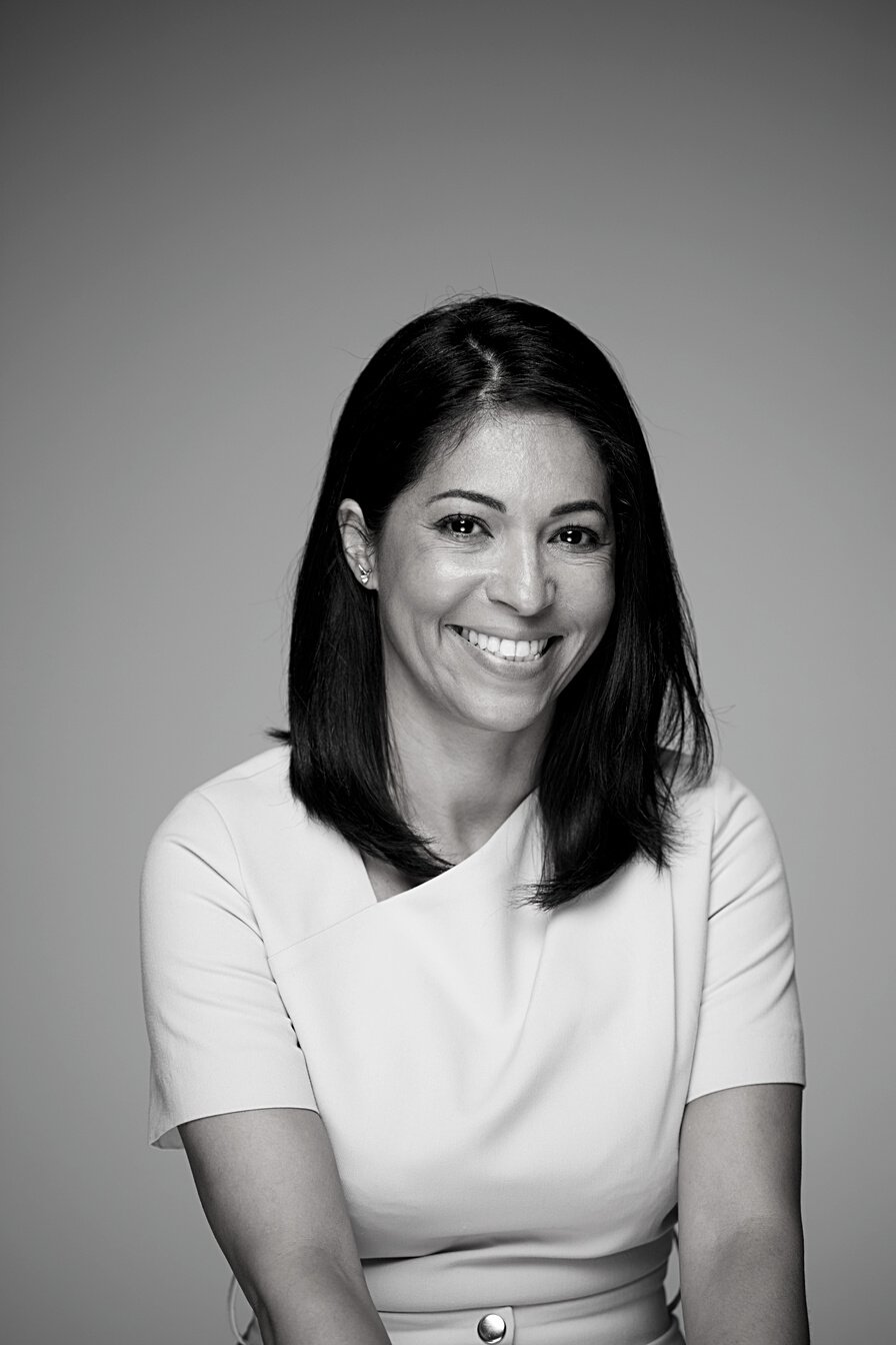 Studio headshot of beautiful Brazilian woman.